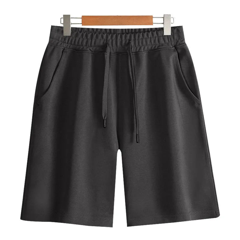 Men's and women's straight cut cotton sports shorts in multiple colours on a plain background.