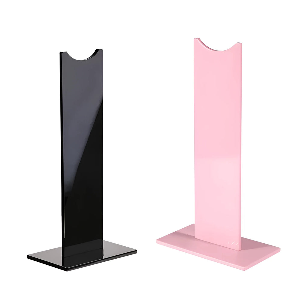 Pink detachable gaming headset stand with non-slip base on a desk, showing its disassembled parts.