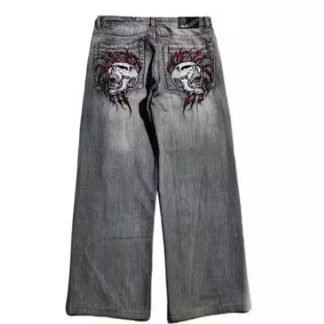 Men's grey washed-out wide-leg straight-cut jeans on a neutral background.