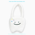 White crossbody shoulder bag with plush large tooth pattern and zipper closure
