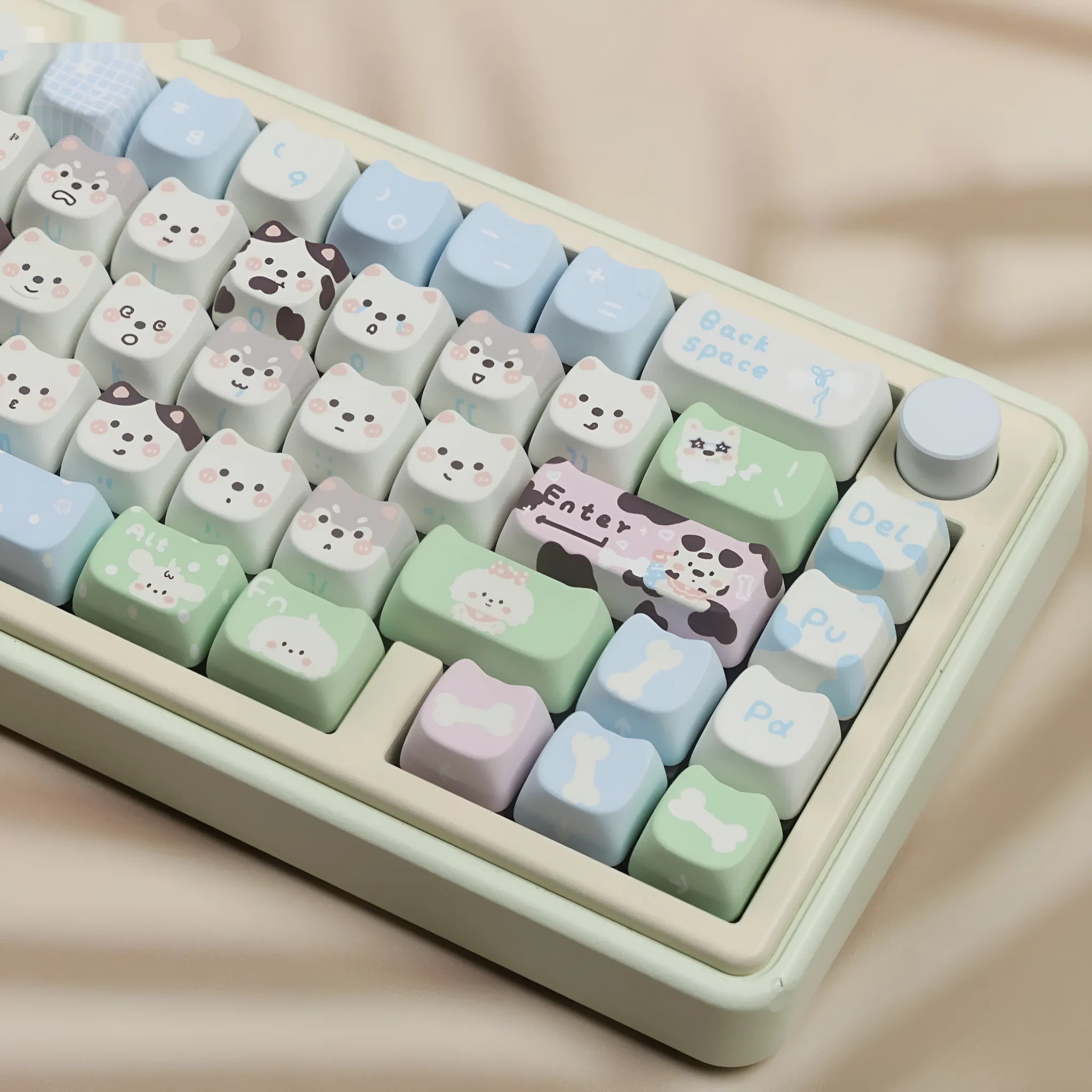 Complete set of 26 PBT key caps with colourful sublimated puppy designs for mechanical keyboards