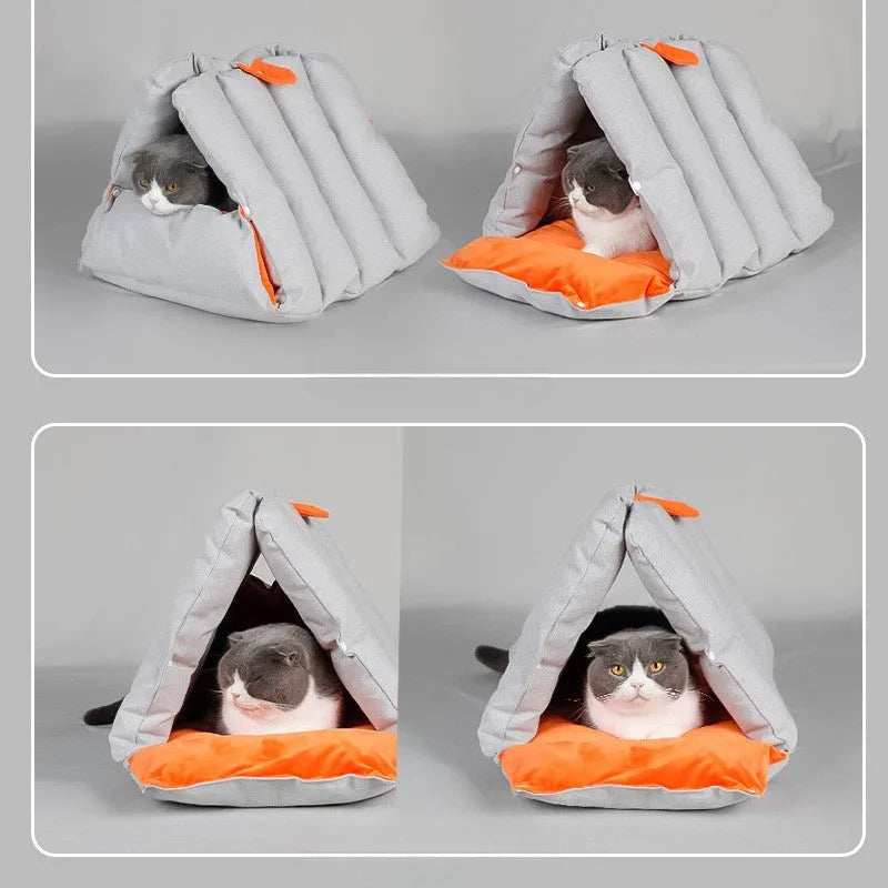 Blue triangular fabric cat bed with a sofa shape and visible connection holes on the sides.