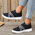 Black women's low-top casual shoes with Flyknit mesh fabric and a flat rubber sole.