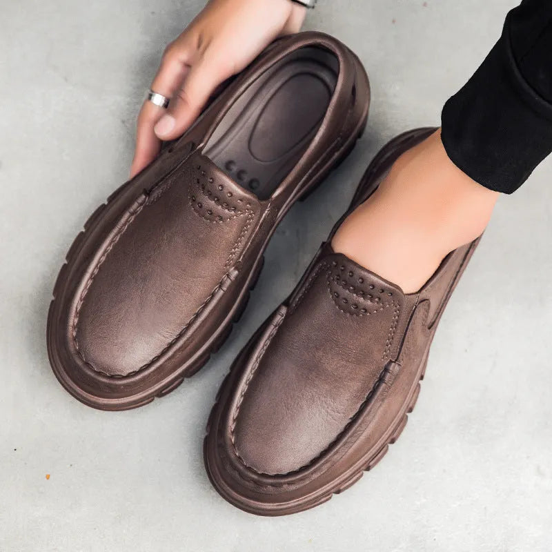 Men's black slip-on casual shoes with a waterproof platform sole and round toe.