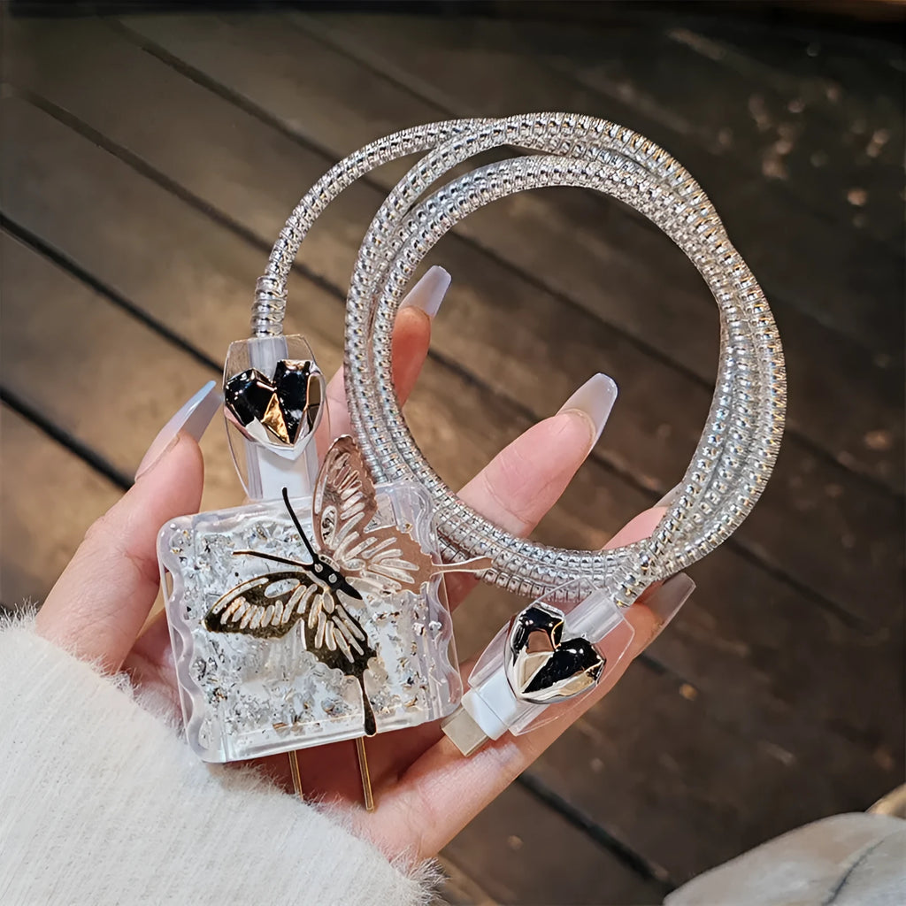 Three-dimensional butterfly USB cable protection sleeve in butterfly colour with silver foil finish on a white background