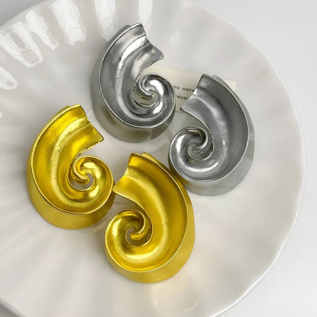 Geometric retro ear studs in gold and silver colours measuring 5cm with alloy construction
