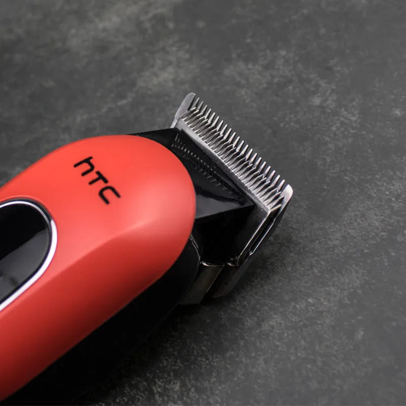 Professional digital hair clipper in black, red, or white with charger and four attachment combs.