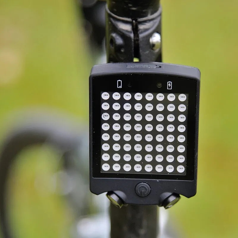 Black LED bicycle turn signal with wireless remote control, turn indicators, graphic tail light and laser parallel line