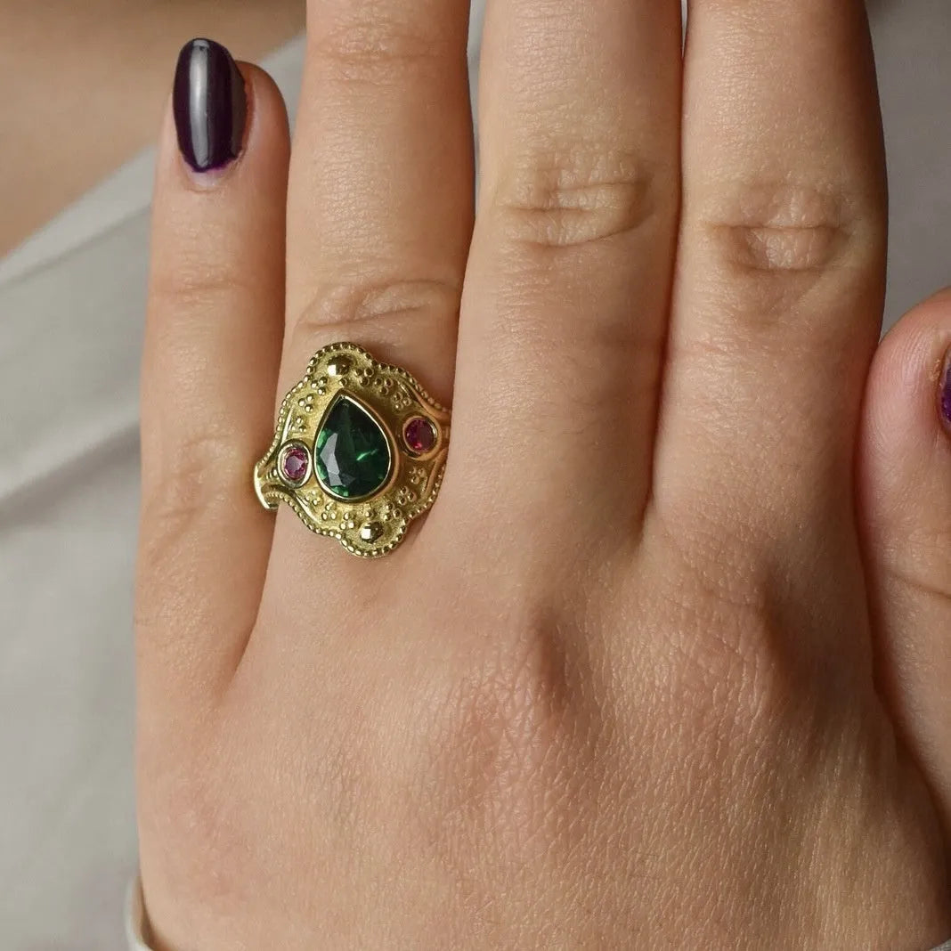 Gold geometric women's ring on display showing alloy construction with electroplated finish