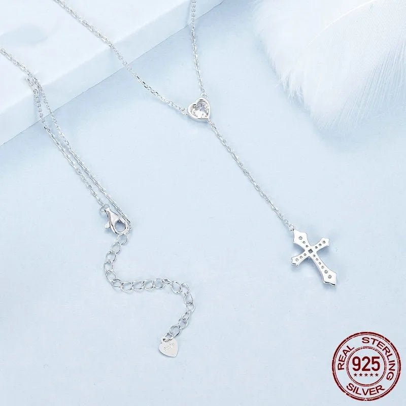 Simple V-neck love cross pendant on a silver O-link chain
