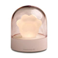 Grey cat paw shaped USB rechargeable night light with music box function on wooden desktop