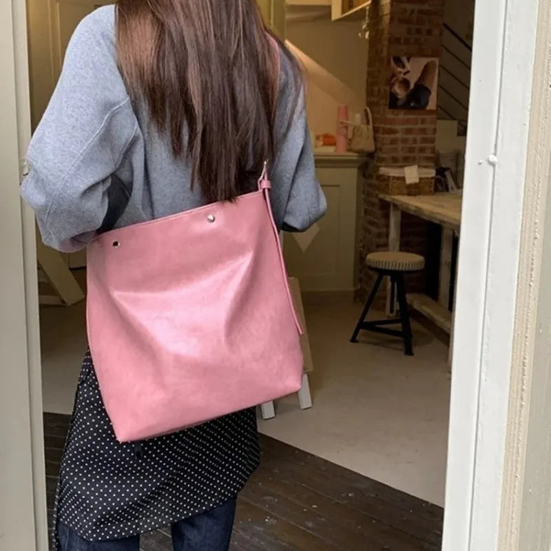 Pink corduroy one-shoulder bag with a single strap, shown with dimensions.
