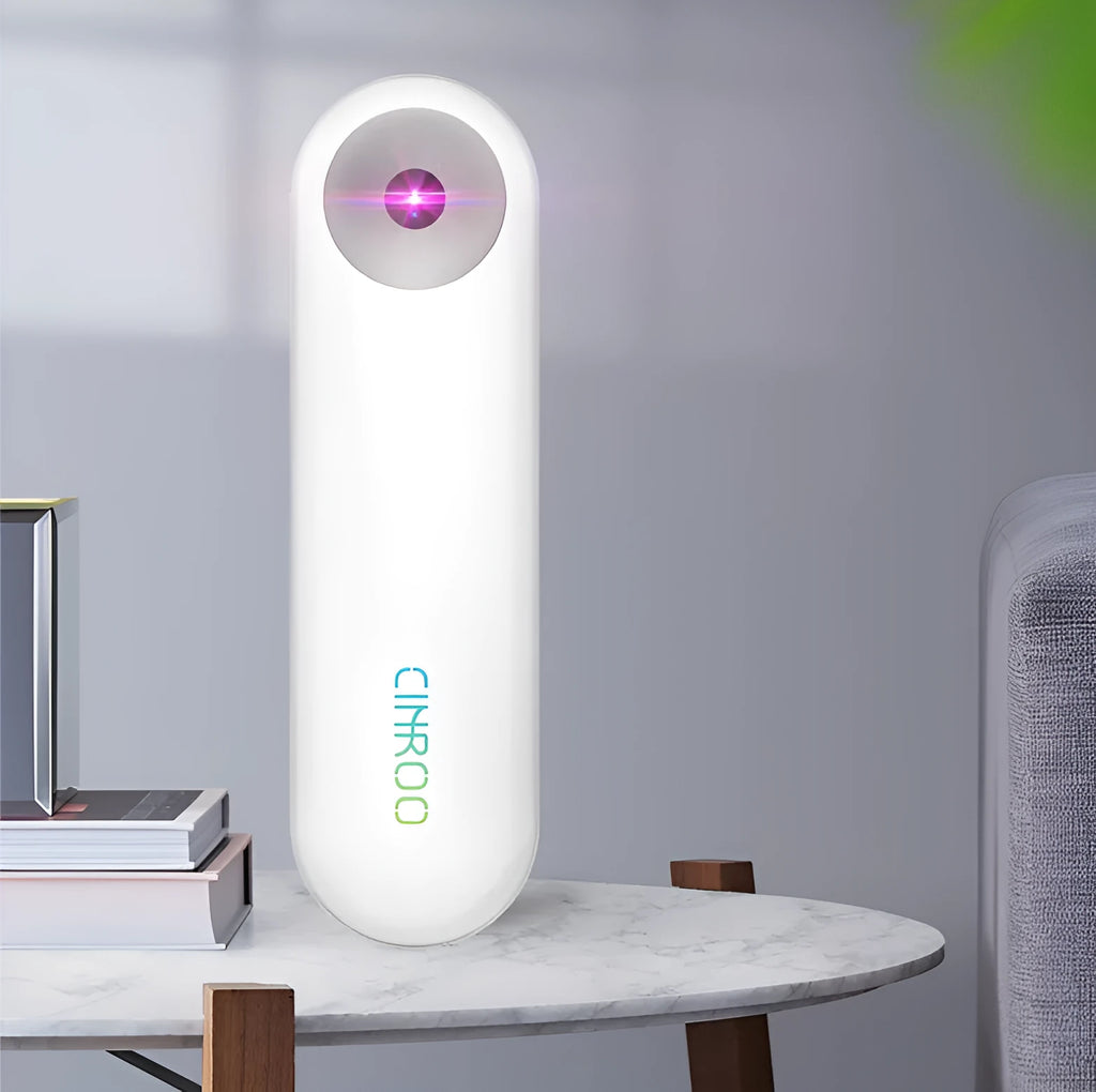 White portable UV sterilizer lamp with compact design for travel disinfection