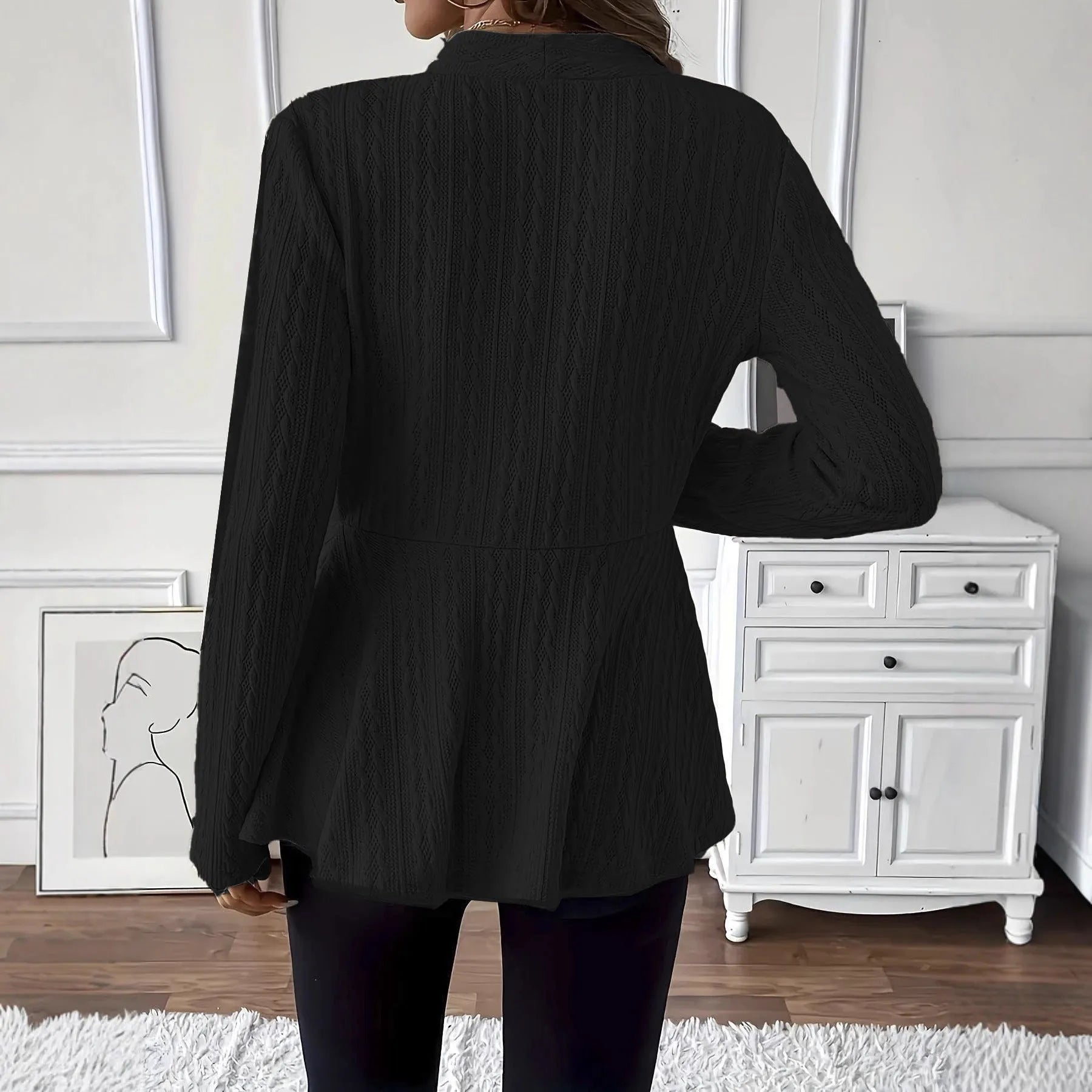 Women's apricot knitted cardigan with Jacquard pattern and one button, shown on a model.