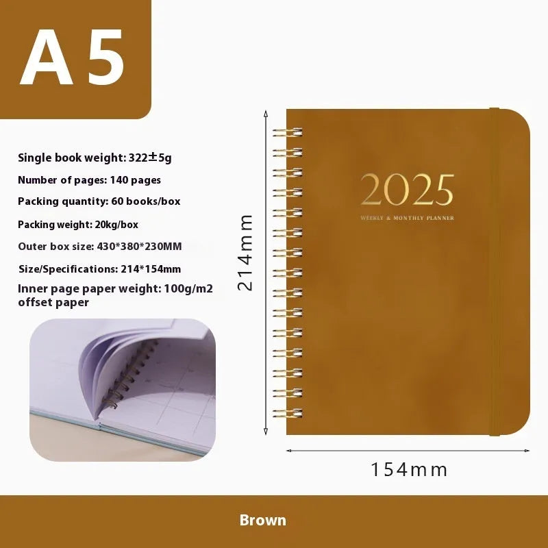 A5 leather notebook with metal coil binding in various colours including black, blue, and green.