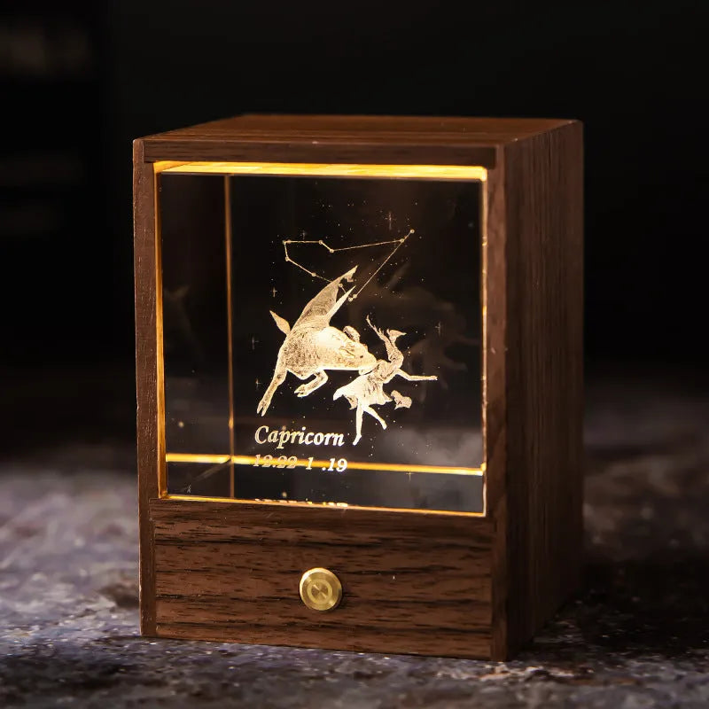 Crystal LED table lamp with black walnut base and K9 crystal showing constellation night light effect