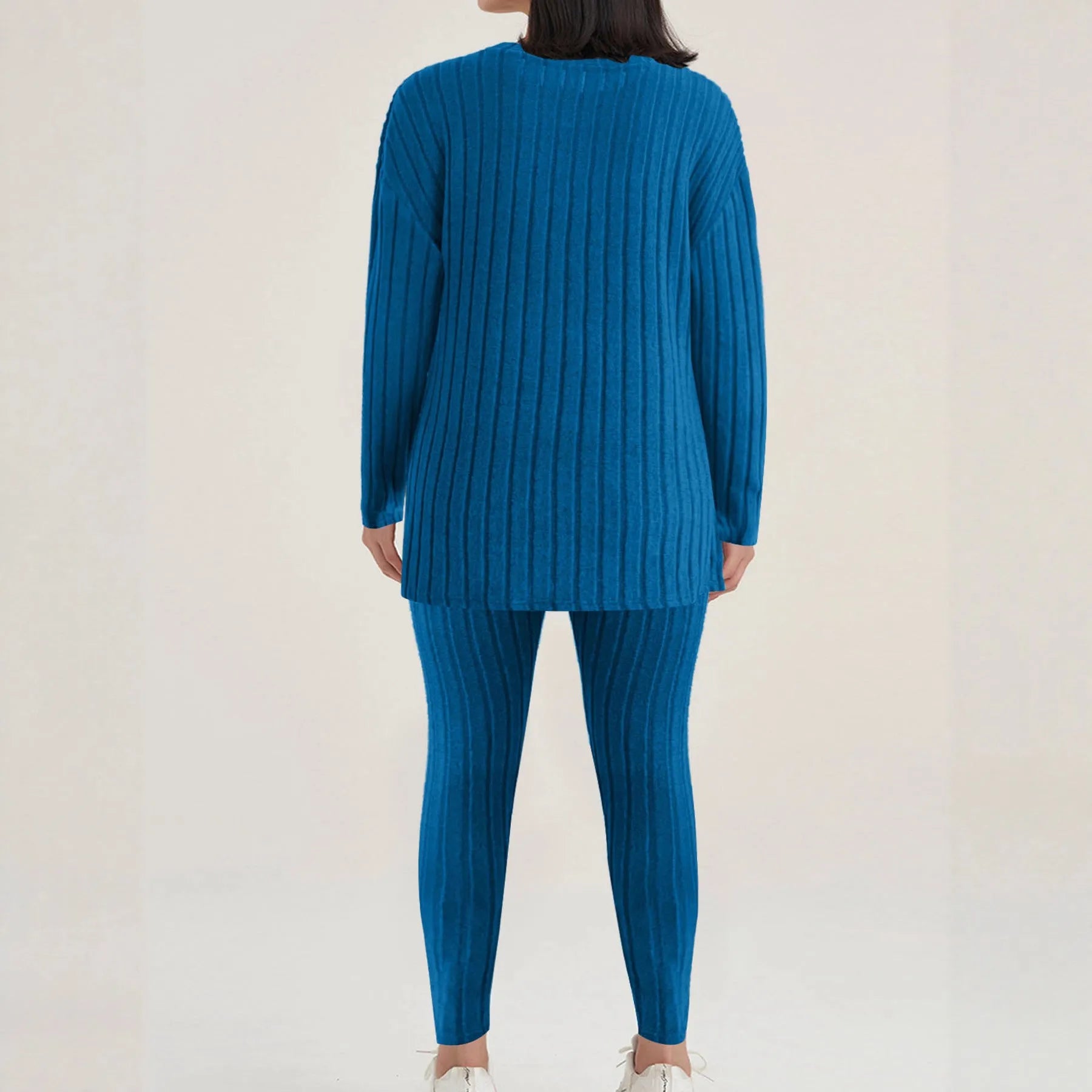 Black sunken stripe pattern two-piece loungewear set with regular sleeves on a hanger.