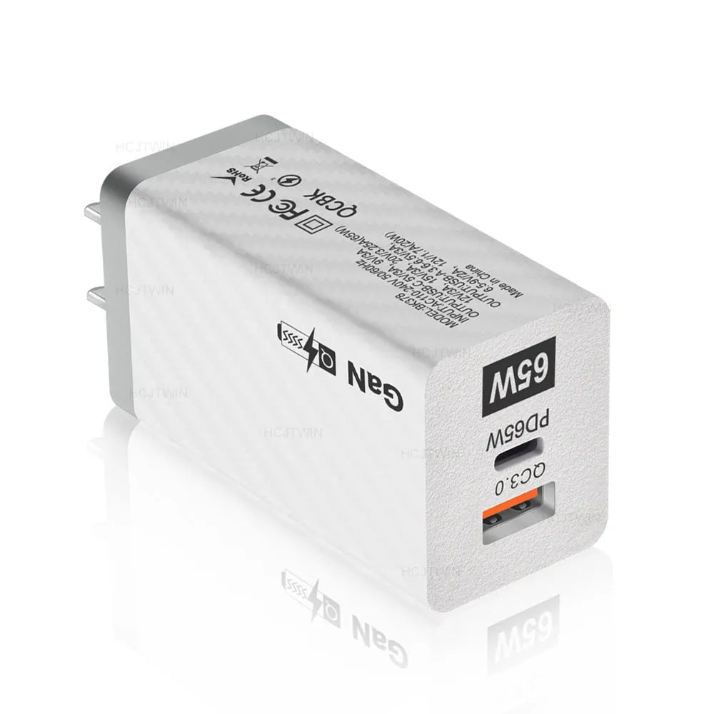 65W gallium nitride fast charger in black or white with compact rectangular design and USB-PD port