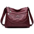 Soft leather shoulder bag in horizontal square shape with large capacity and internal zipper compartment