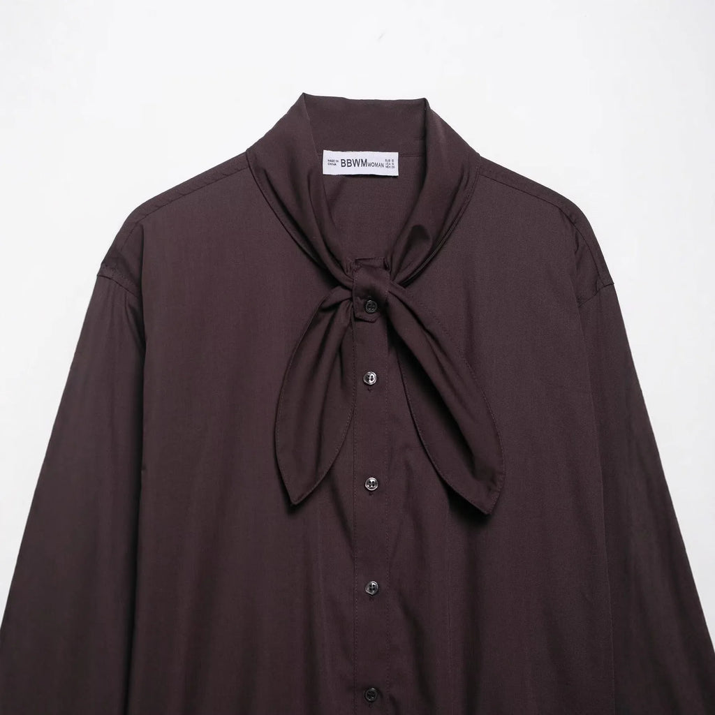 Brown women's poplin shirt with scarf bow tie detail and loose cardigan style