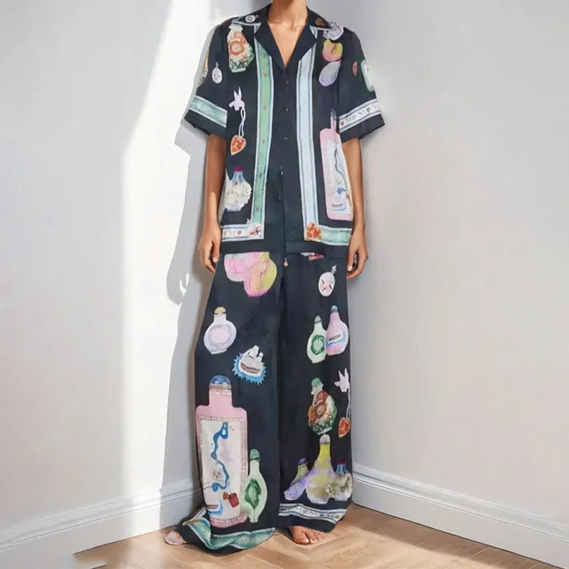 Black women's casual set with anime cartoon print, featuring a long sleeve cardigan and matching trousers.