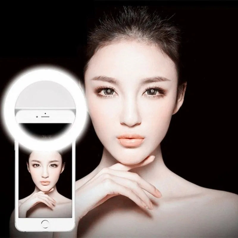 Clip-on selfie ring light with LED bulbs attached to mobile phone for photography
