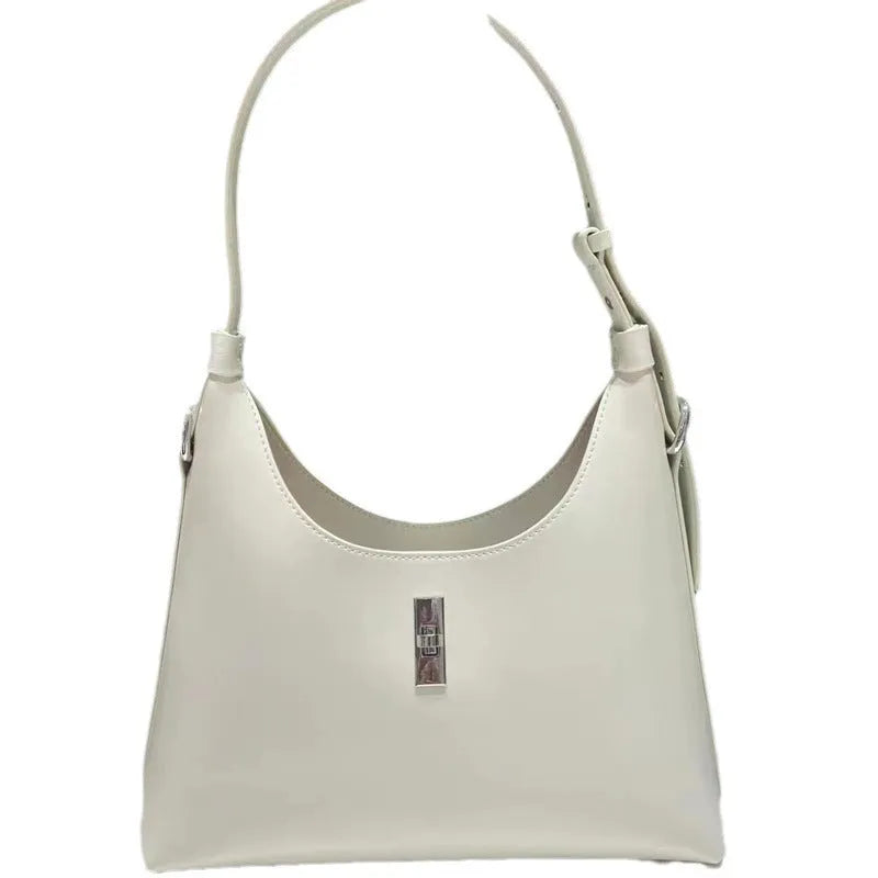 Soft genuine leather dumpling-shaped crossbody bag in apricot colour with visible stitching.