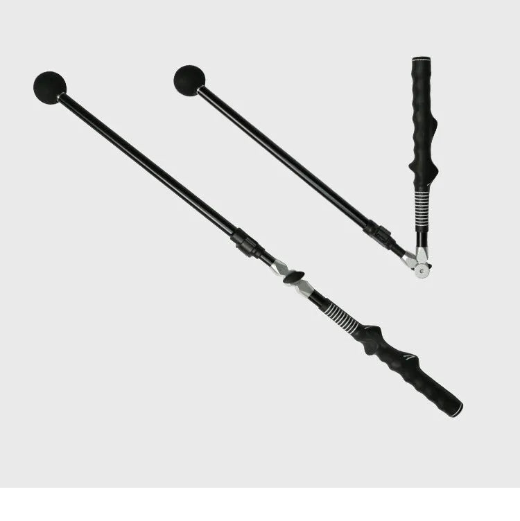 Golf folding swing trainer with black aluminium shaft and rubber grip on grass