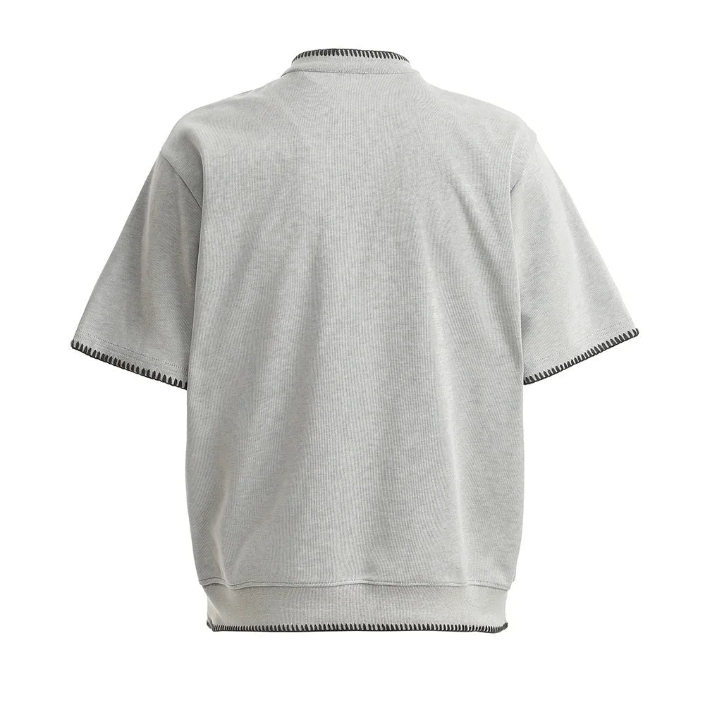 Men's short-sleeved polo shirt in cotton with loose fit, light gray colour, front view