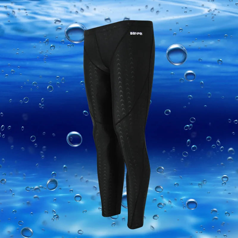 Men's black and green line nylon cropped swimming trunks on a white background.