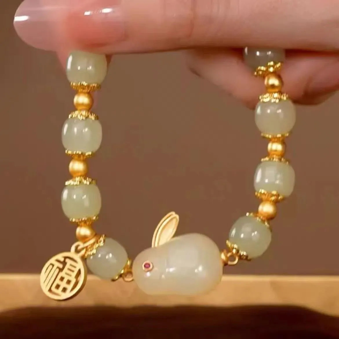 Green jade fu character lucky bracelet with hare charm on adjustable black cord