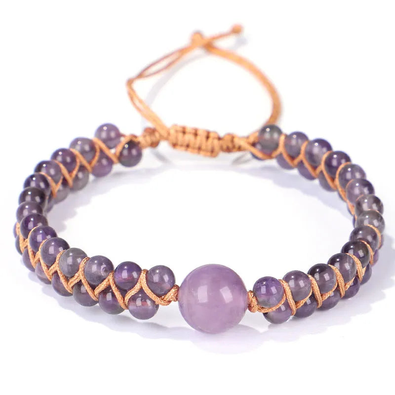 Close-up of a handmade woven bracelet with geometric tiger eye beads on an adjustable band.