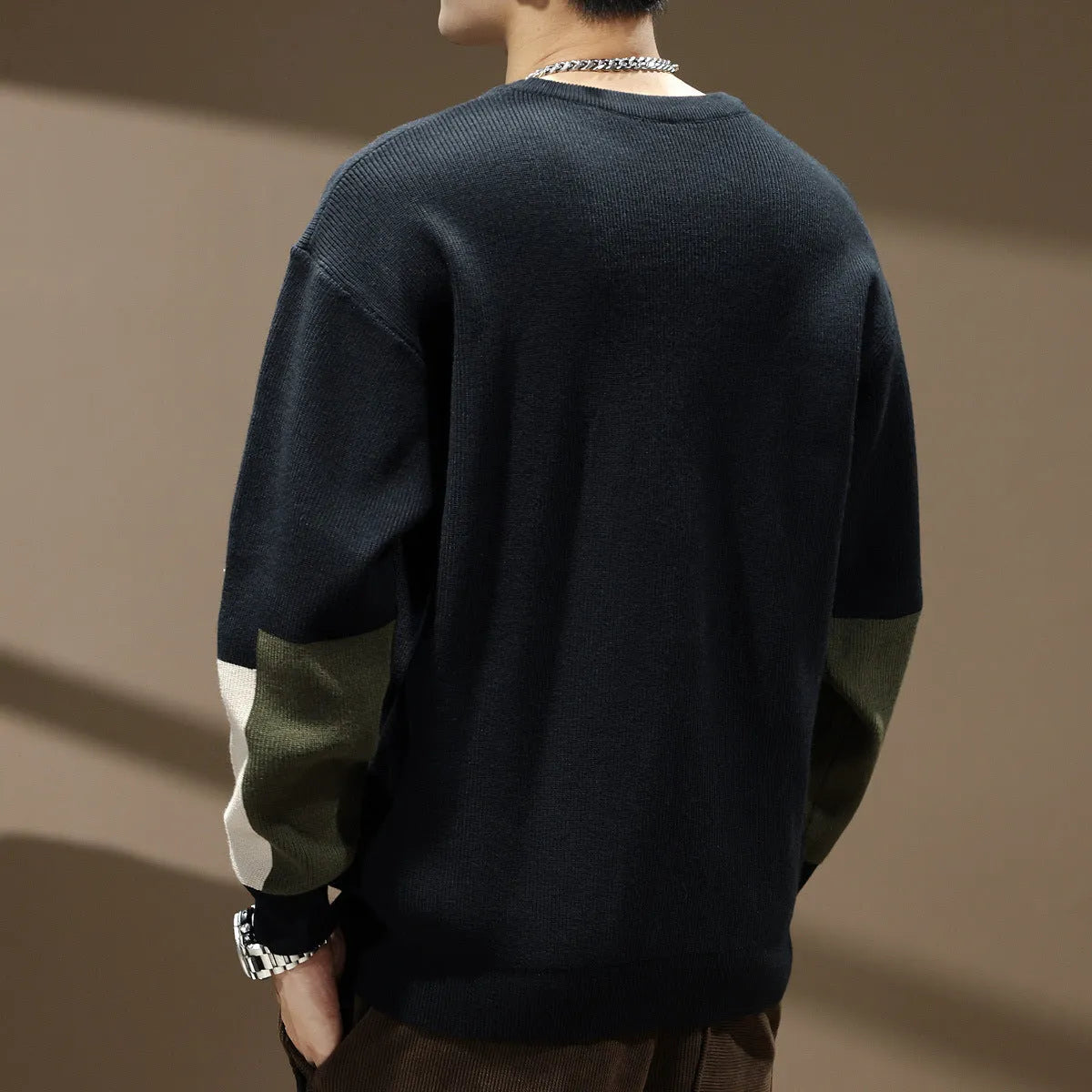 Men's oversized pullover sweater in black or walnut with colour contrast patchwork and long sleeves