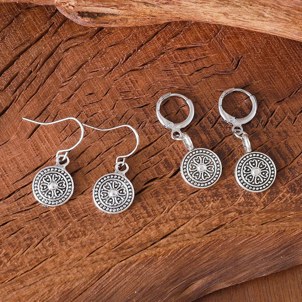 Bohemian style geometric earrings with distressed round print ethnic designs