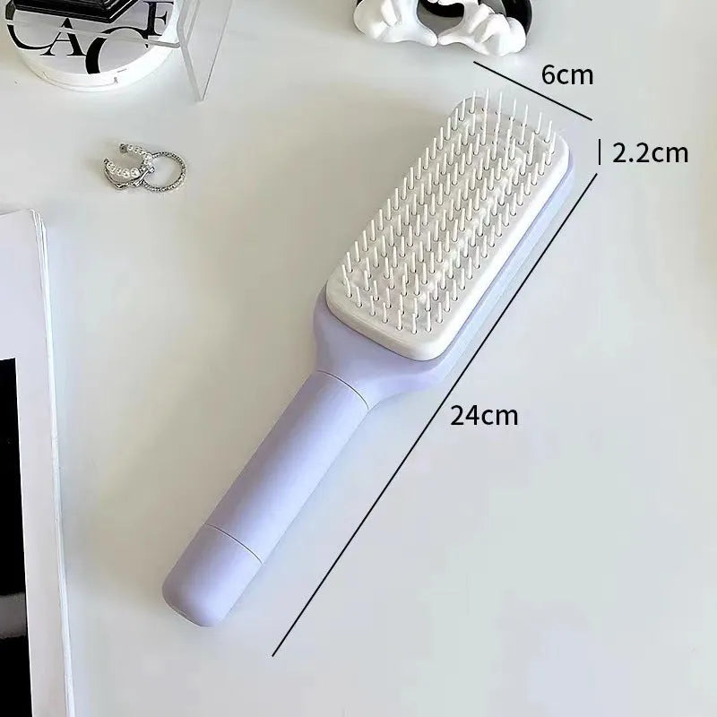 Roland purple self-cleaning hair brush with rotating handle and anti-static teeth