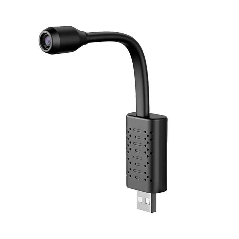 Black V380 wireless USB HD camera for computer security monitoring on a desk.