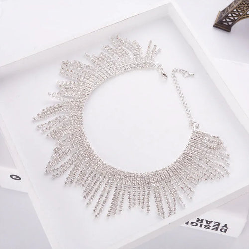 Alloy necklace with gold electroplated finish, geometric tassel pendant, diamond centre, box chain on white background