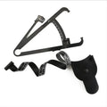 Black body fat caliper skin fold measuring instrument with two coiled measuring tapes on a grey background.