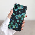 Black silicone iPhone case with leaf pattern design showing front and back views