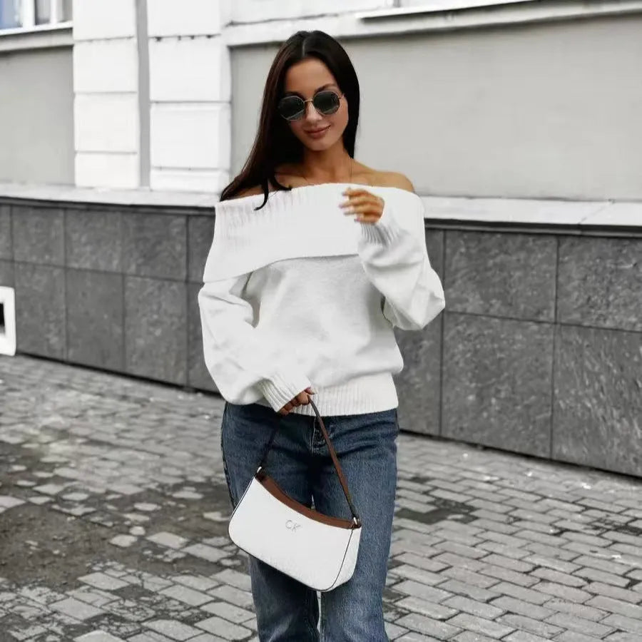 Woman wearing a grey off-the-shoulder sweater with a 3D textured pattern.