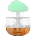 White raining cloud shaped humidifier with coloured LED light and USB cable.