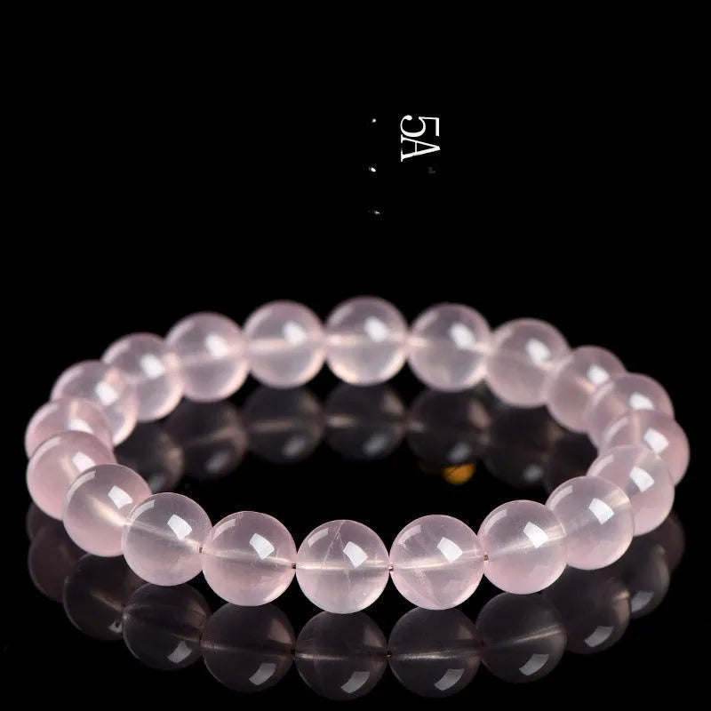 Polished natural crystal bracelet with round beads in pink colour, available in multiple bead diameters