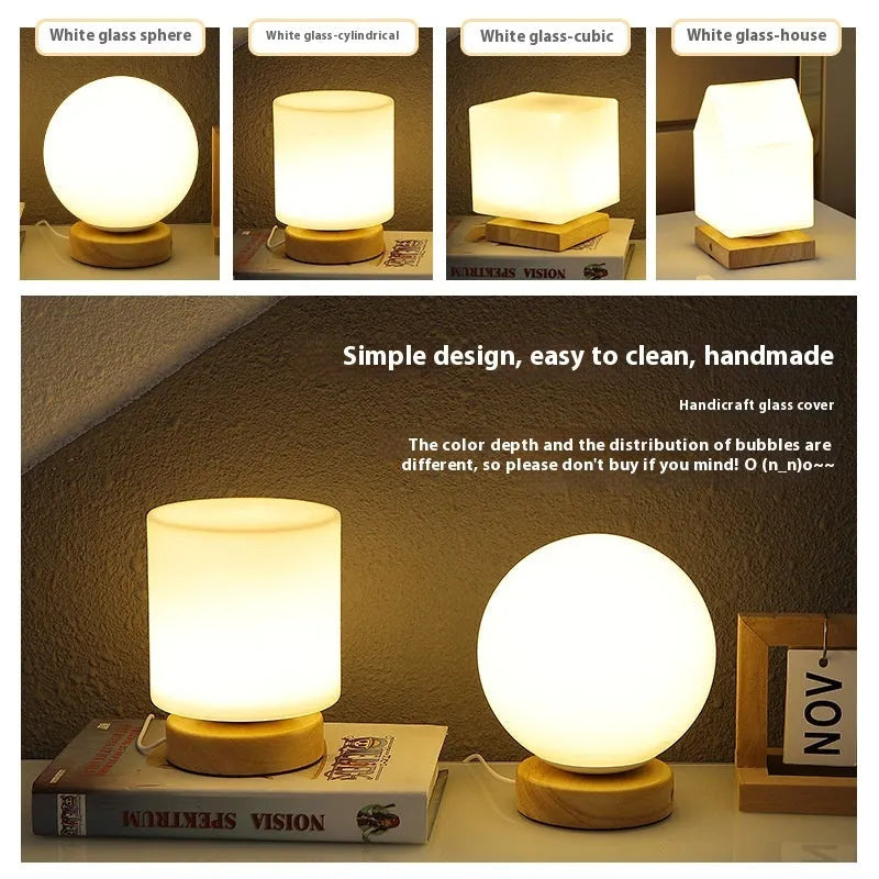 Nordic white geometric table lamp with solid wood base and USB charging port on a wooden desk.