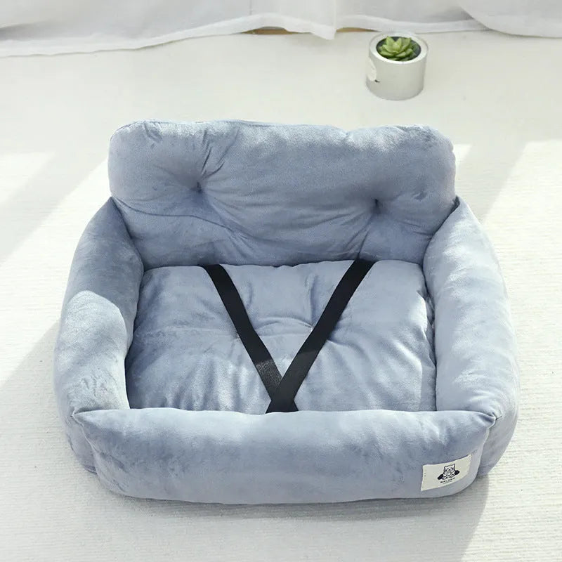 Grey and blue plaid portable dog car travel nest with stain-resistant cloth fabric.