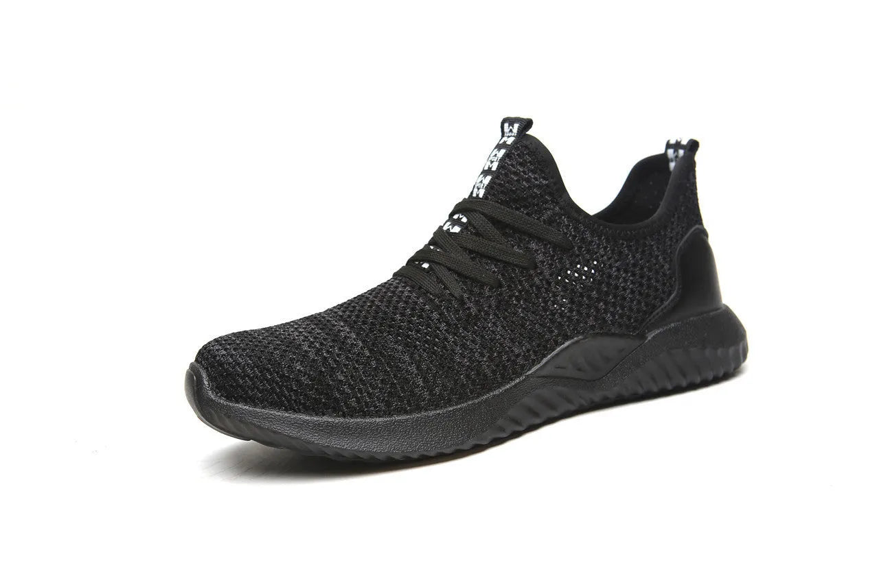 Men's black steel toe safety shoes with low-cut design on a work surface
