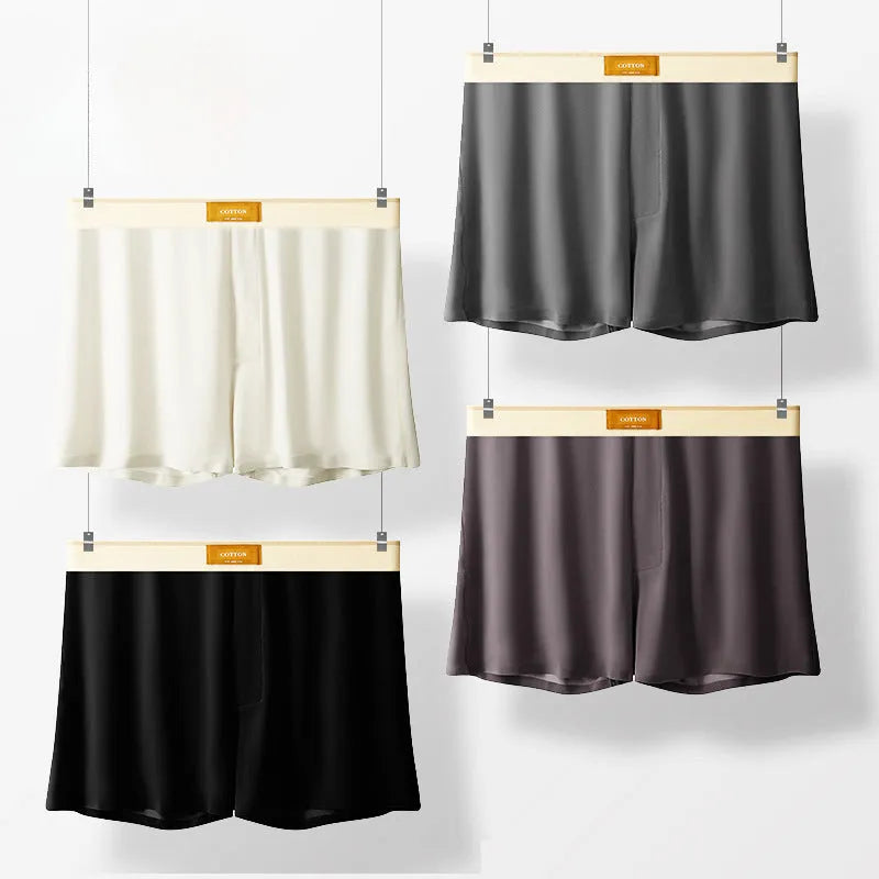 Men's solid colour loose ice silk underwear in beige apricot, laid flat.