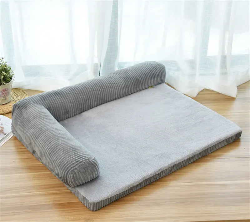 Corduroy dog sofa bed with bolster sides in grey colour on wooden floor