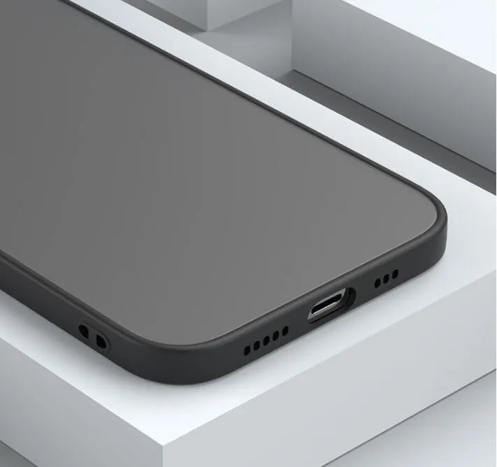 Black frosted hard iPhone case with fine hole skin-sensing design on a table.
