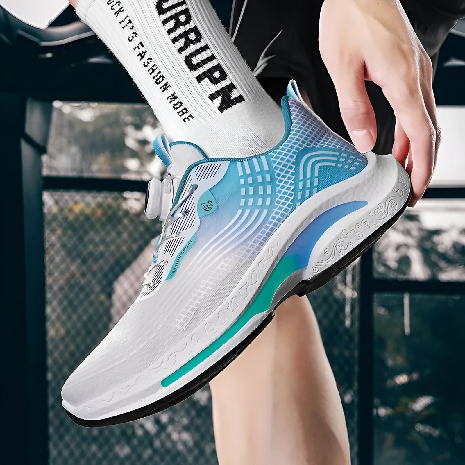 Men's low-top sneaker in white and blue with a rotating buckle and breathable mesh upper