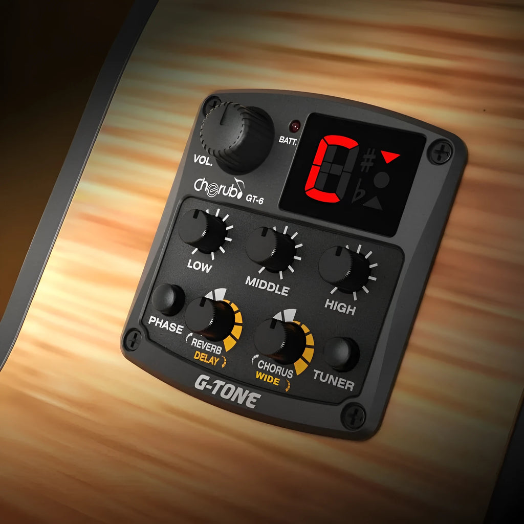 Black Cherub GT-6 acoustic guitar EQ pickup control unit with knobs for tone, volume, and effects.